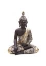 Metaliczna figurka z tajskim budd siedzcym po turecku